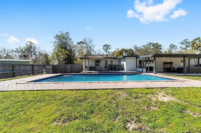 view of pool with a fenced in pool, a patio area, a fenced backyard, and a yard