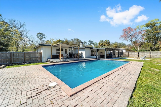 view of pool with a fenced in pool, a patio area, and a fenced backyard