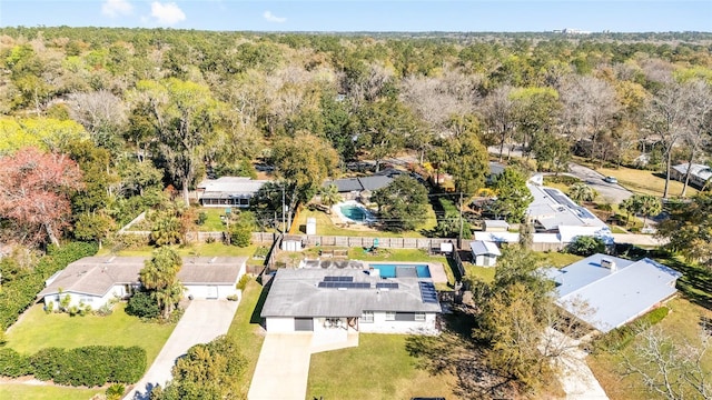 bird's eye view with a residential view and a wooded view