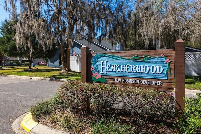 community sign with fence