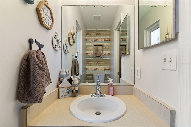 bathroom with visible vents and vanity