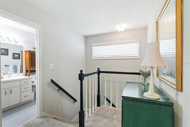 staircase with carpet and baseboards