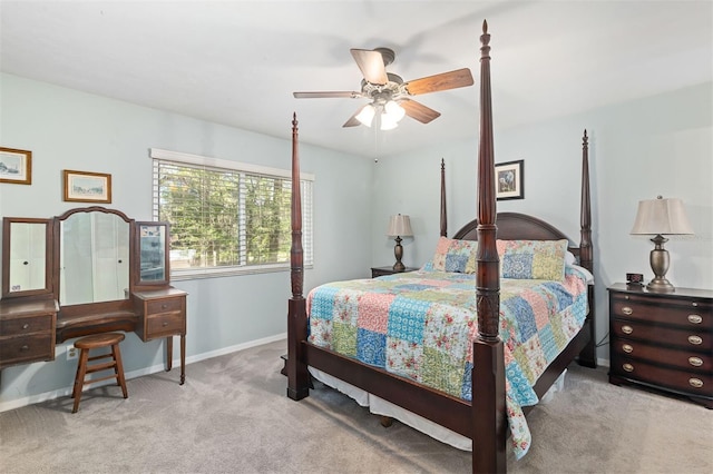 bedroom with a ceiling fan, carpet flooring, and baseboards