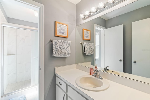 full bath featuring a stall shower and vanity