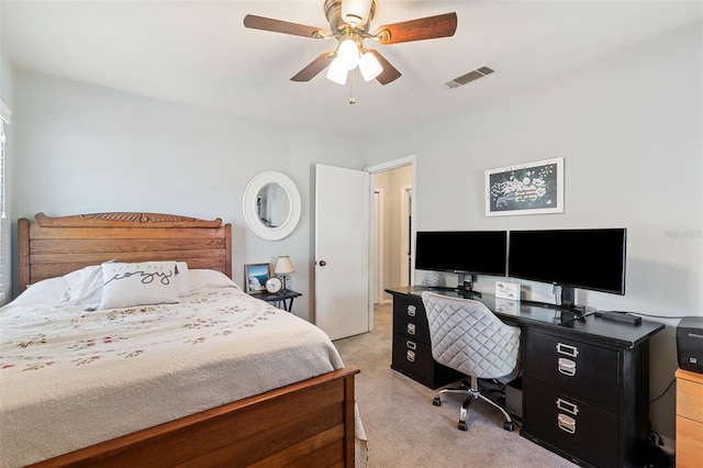 bedroom with light colored carpet, visible vents, and a ceiling fan