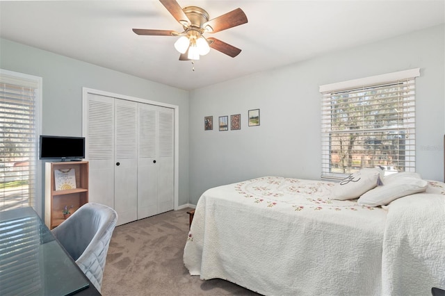 bedroom featuring a closet, carpet flooring, and a ceiling fan