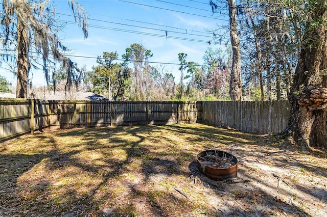 view of yard with a fenced backyard