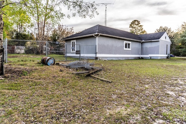 exterior space featuring fence and a yard