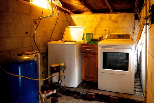 laundry area with washing machine and dryer and cabinet space