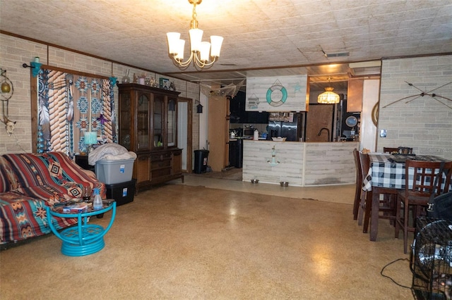 interior space featuring an inviting chandelier, brick wall, and visible vents