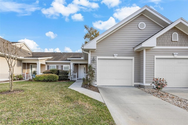 view of front of property with a garage, a front yard, and concrete driveway