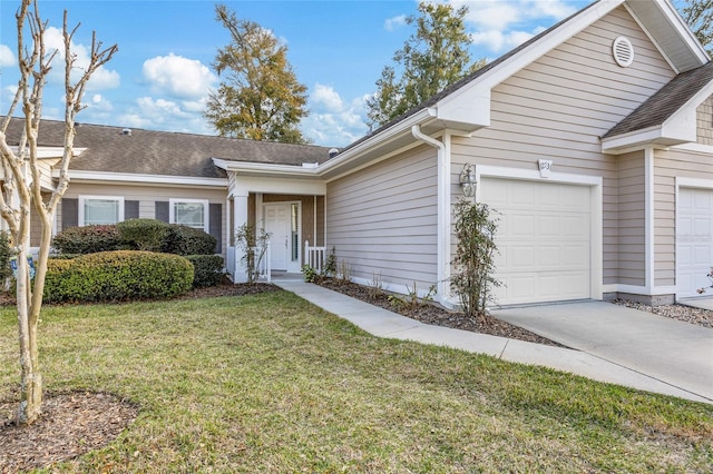 single story home with an attached garage, a front lawn, and concrete driveway