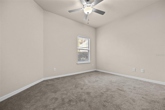 unfurnished room featuring carpet, a ceiling fan, and baseboards