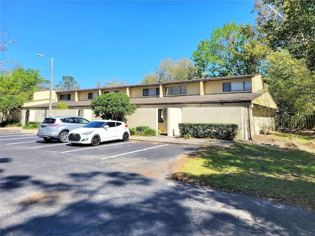 townhome / multi-family property with uncovered parking