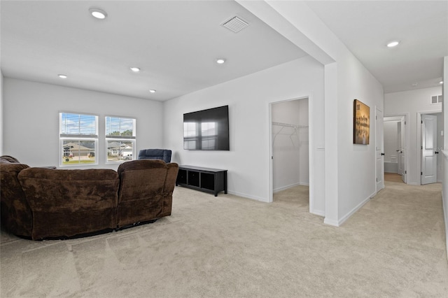 living area featuring recessed lighting, light colored carpet, visible vents, and baseboards