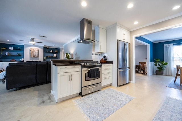 kitchen featuring crown molding, dark countertops, appliances with stainless steel finishes, and wall chimney range hood
