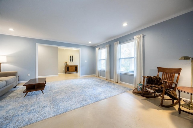 living area featuring finished concrete floors, baseboards, recessed lighting, and ornamental molding