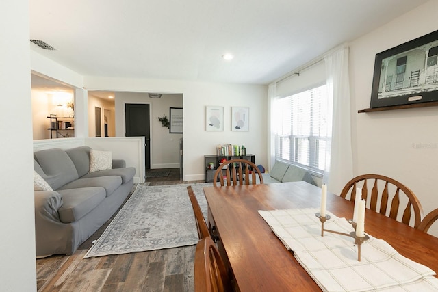 dining room featuring visible vents, recessed lighting, baseboards, and dark wood-style flooring