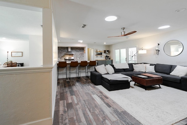 living room with visible vents, recessed lighting, a ceiling fan, and wood finished floors