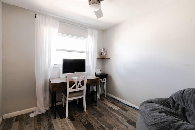 home office with baseboards, dark wood-type flooring, and a ceiling fan