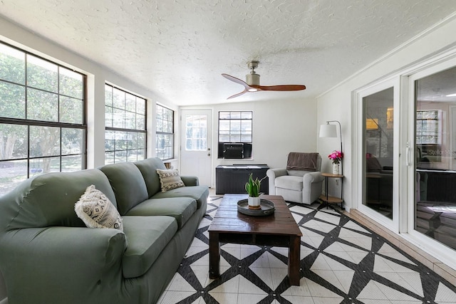 sunroom / solarium featuring cooling unit, a ceiling fan, and radiator heating unit