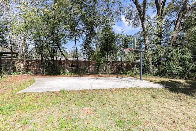 exterior space featuring fence and basketball court