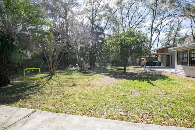 view of yard with an attached carport