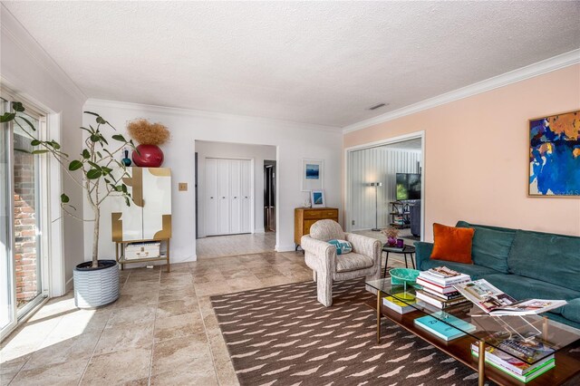 living room featuring a textured ceiling, visible vents, and crown molding