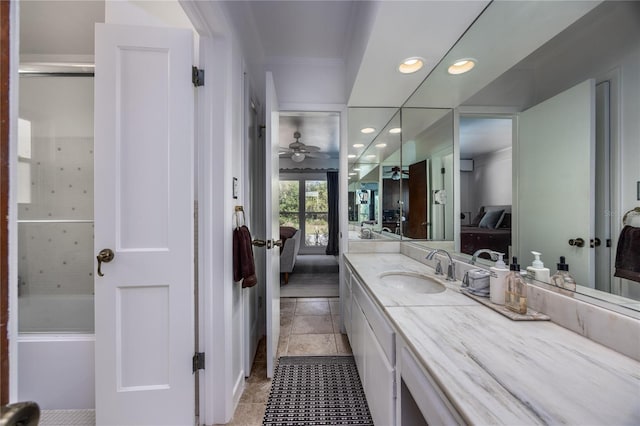 ensuite bathroom featuring recessed lighting, ceiling fan, vanity, and ensuite bathroom