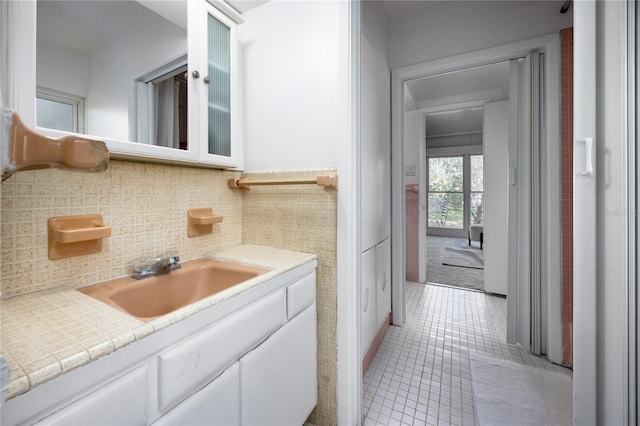 bathroom featuring tile patterned flooring and vanity