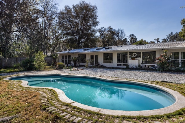 view of pool featuring a fenced in pool and fence