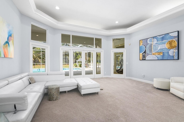 sunroom / solarium with a tray ceiling and french doors