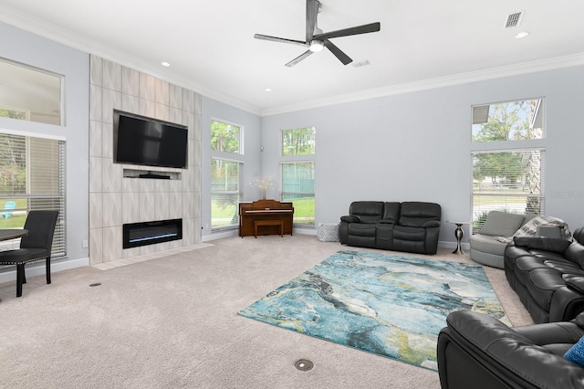 living room with ornamental molding, carpet flooring, and a healthy amount of sunlight