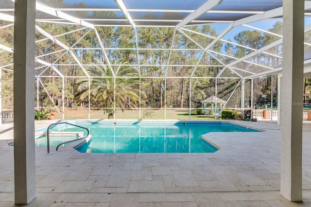 pool featuring a lanai, a patio area, and a jacuzzi