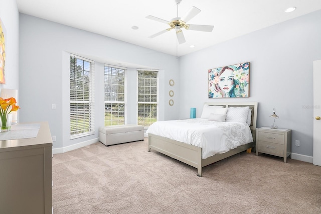 bedroom with light carpet, ceiling fan, recessed lighting, and baseboards