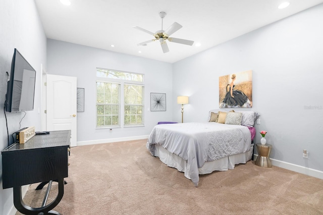 bedroom featuring light carpet, recessed lighting, and baseboards