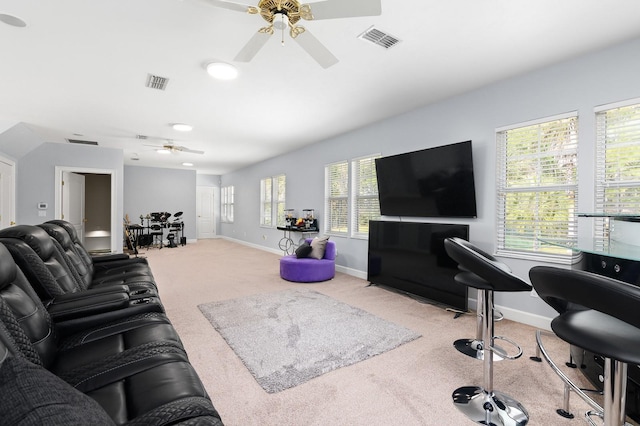 living room featuring carpet floors, visible vents, and baseboards