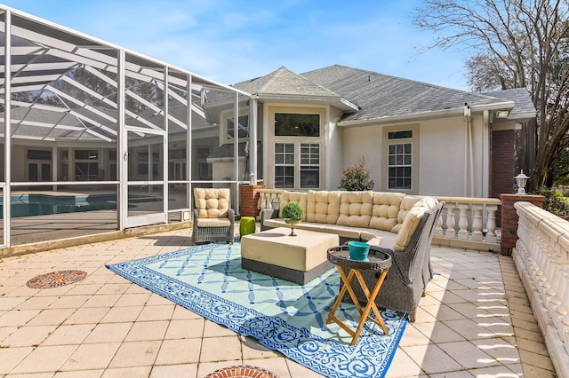 view of patio with outdoor lounge area, a lanai, and an outdoor pool