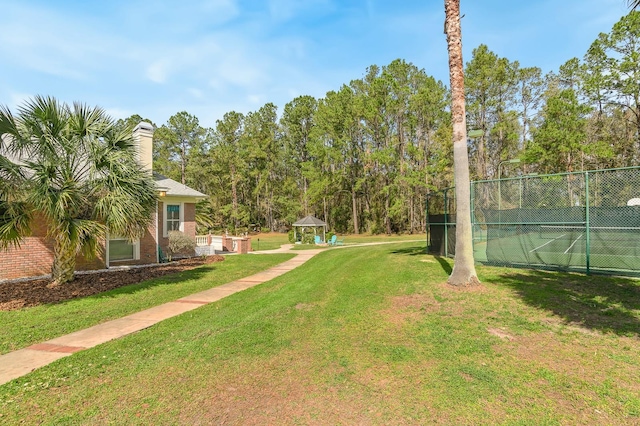 view of yard with fence and a gazebo