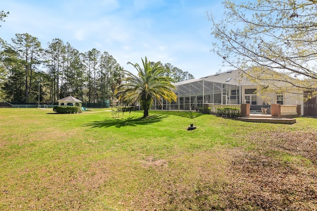 view of yard featuring a lanai and a gazebo