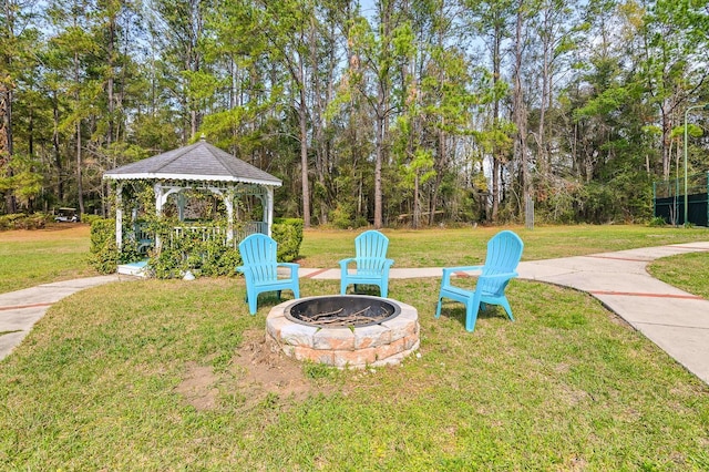 view of yard with a fire pit and a gazebo