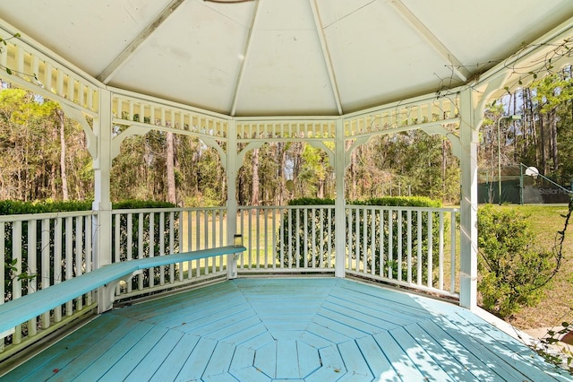 wooden terrace featuring a gazebo