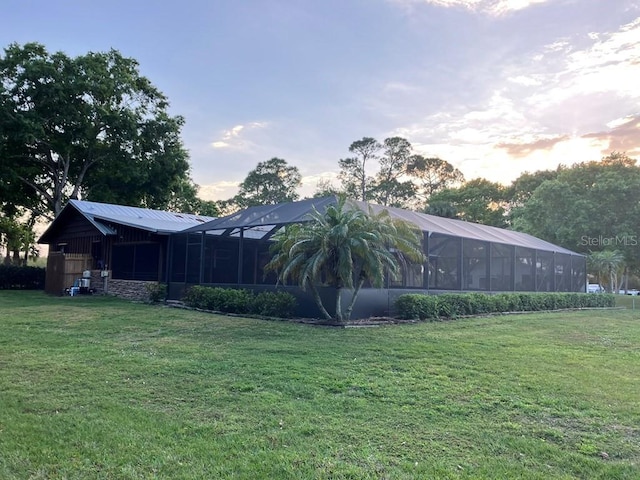 view of yard featuring glass enclosure