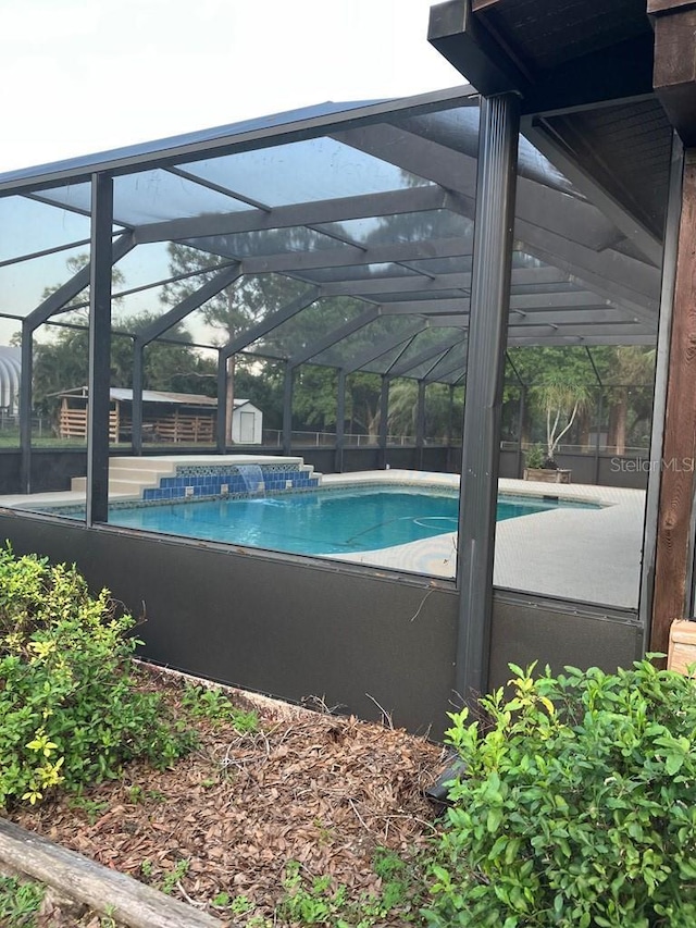 pool featuring glass enclosure