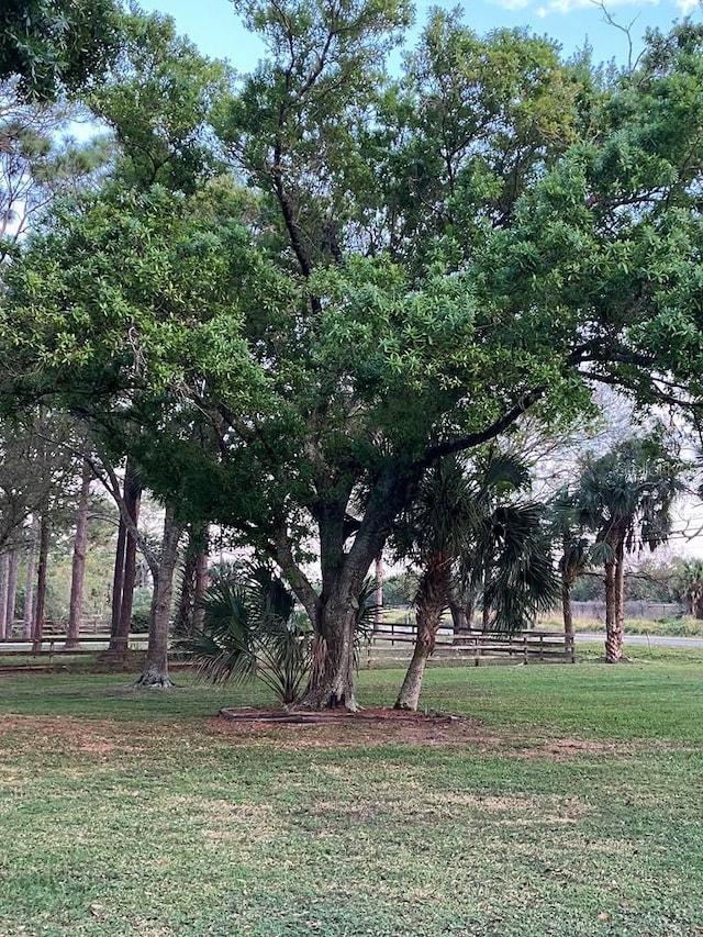 view of home's community featuring a lawn