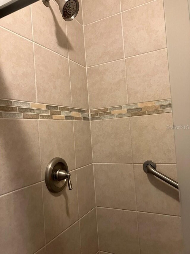 details featuring a tile shower