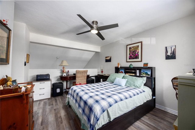 bedroom with ceiling fan, vaulted ceiling, and wood finished floors