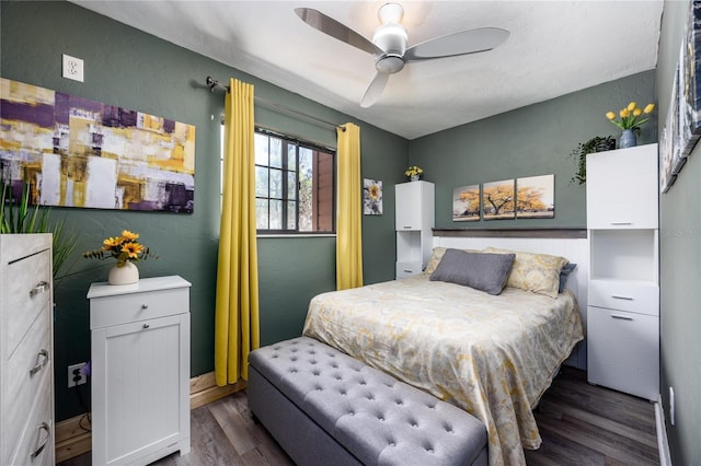 bedroom featuring dark wood-style floors and ceiling fan