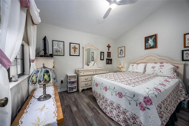 bedroom with dark wood-style floors, ceiling fan, and vaulted ceiling