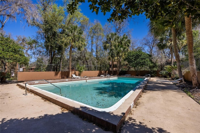 community pool featuring fence